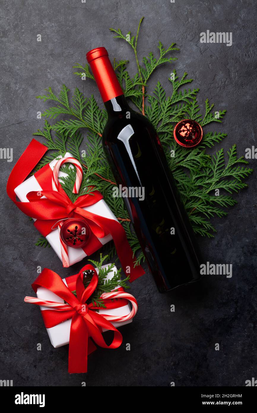 Christmas gift boxes and wine bottle. Top view flat lay Stock Photo - Alamy