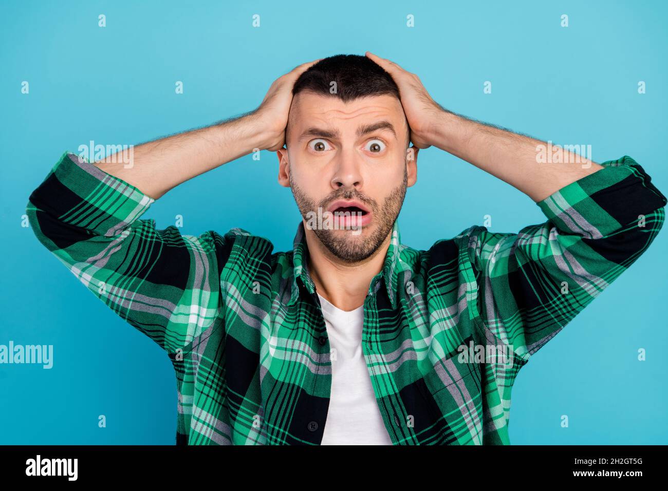 Photo of amazed shocked upset young man hold hands head forget mistake ...