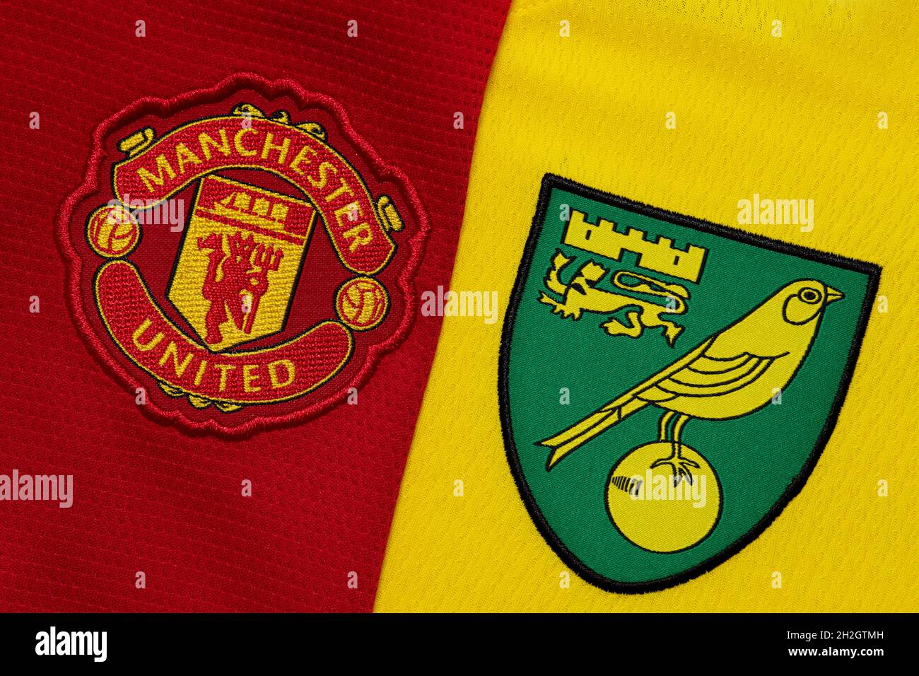 Close up of Man United and Norwich City club crest. Stock Photo