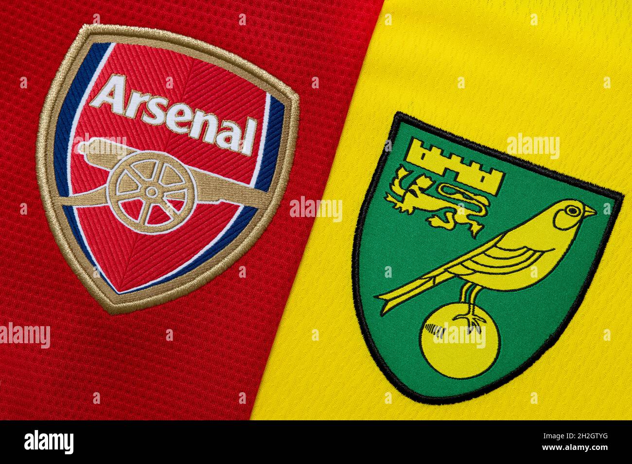 Close up of Arsenal and Norwich club crest. Stock Photo