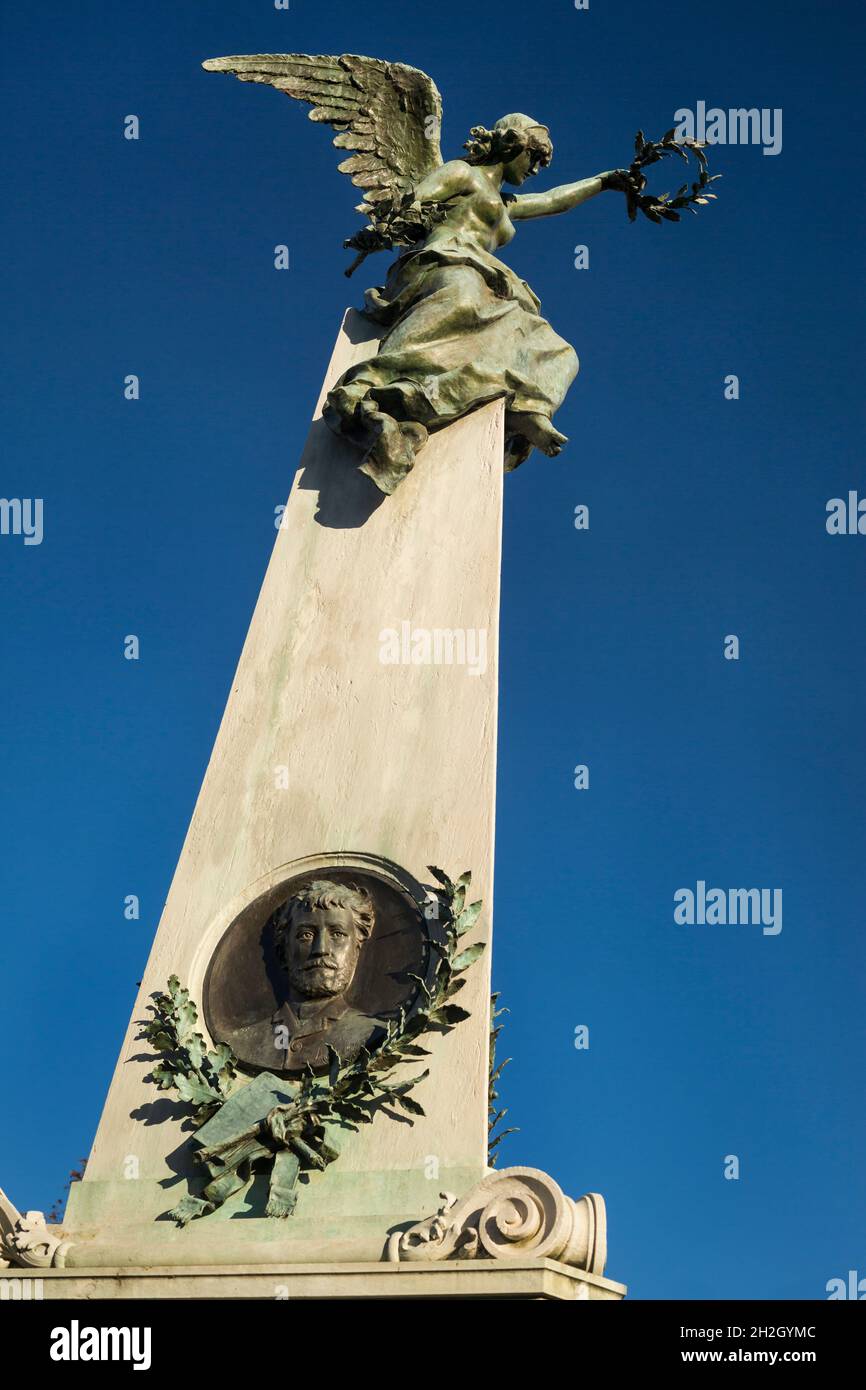 Hi Ranking Angel Vertical low angle view of a bronze angel statue decorating the grave ...