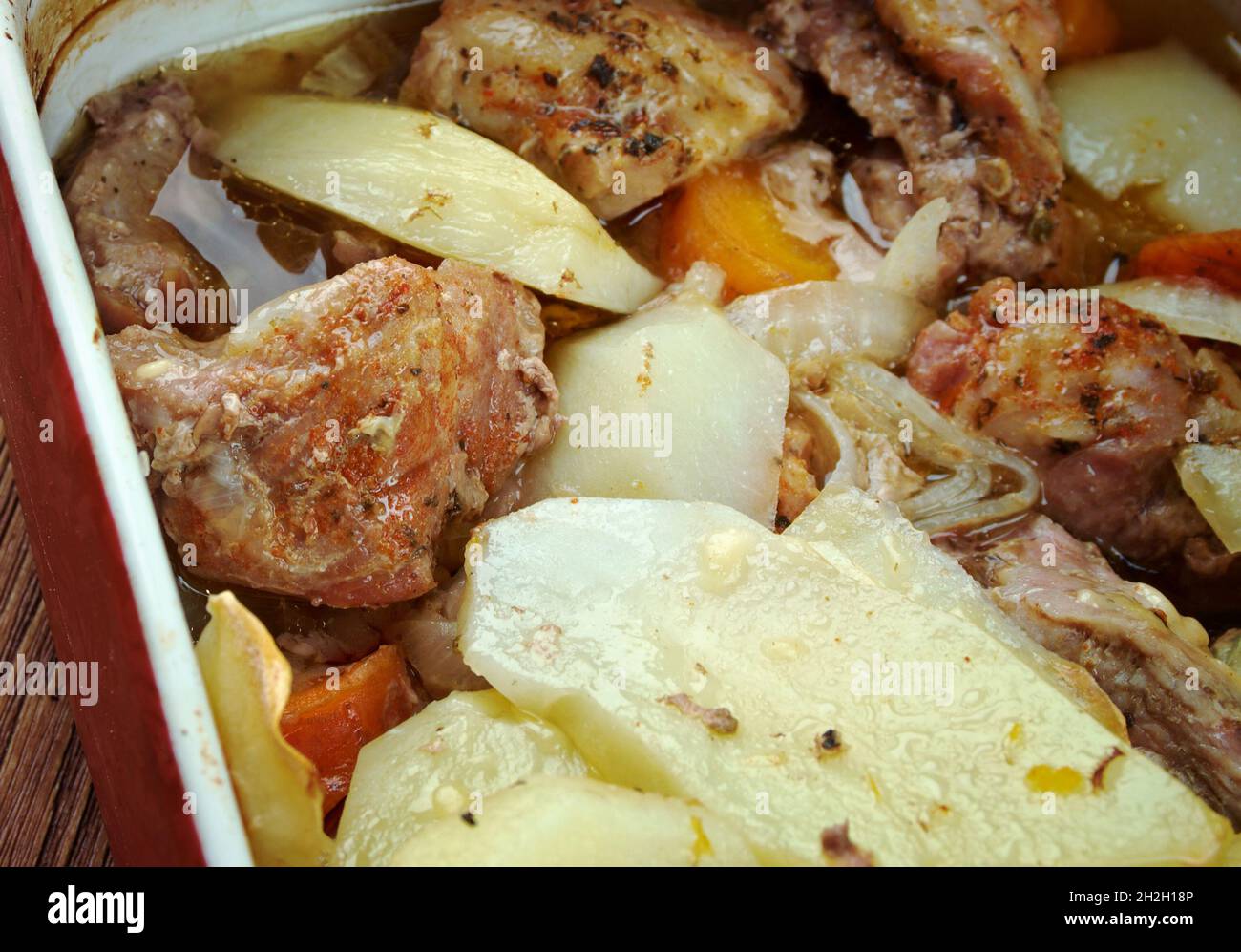 Arni me patates sto fournod - roasted lamb is the classic Easter feast for most Greeks Stock Photo