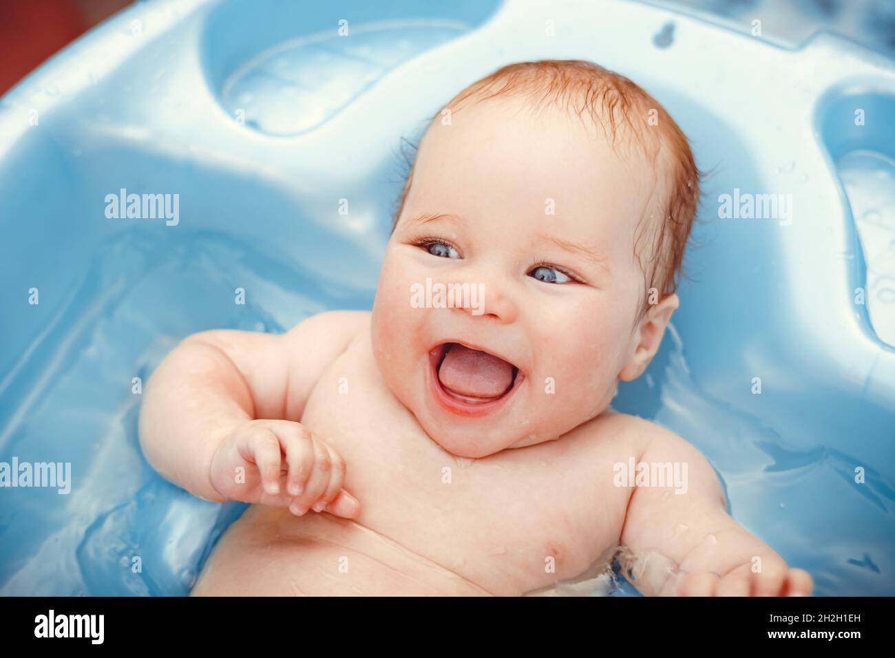 baby boy bathed in the outdoor tub Stock Photo Alamy