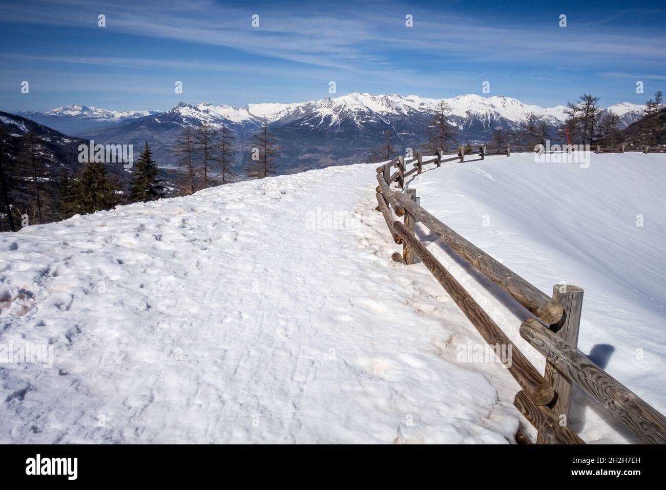 Mountain landscape under snow in winter and frozen lake Stock Photo