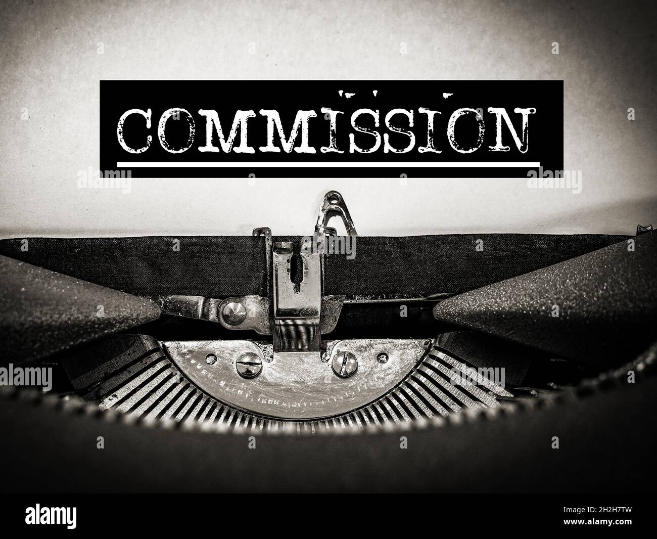 Commission displayed on a Typewriter Stock Photo