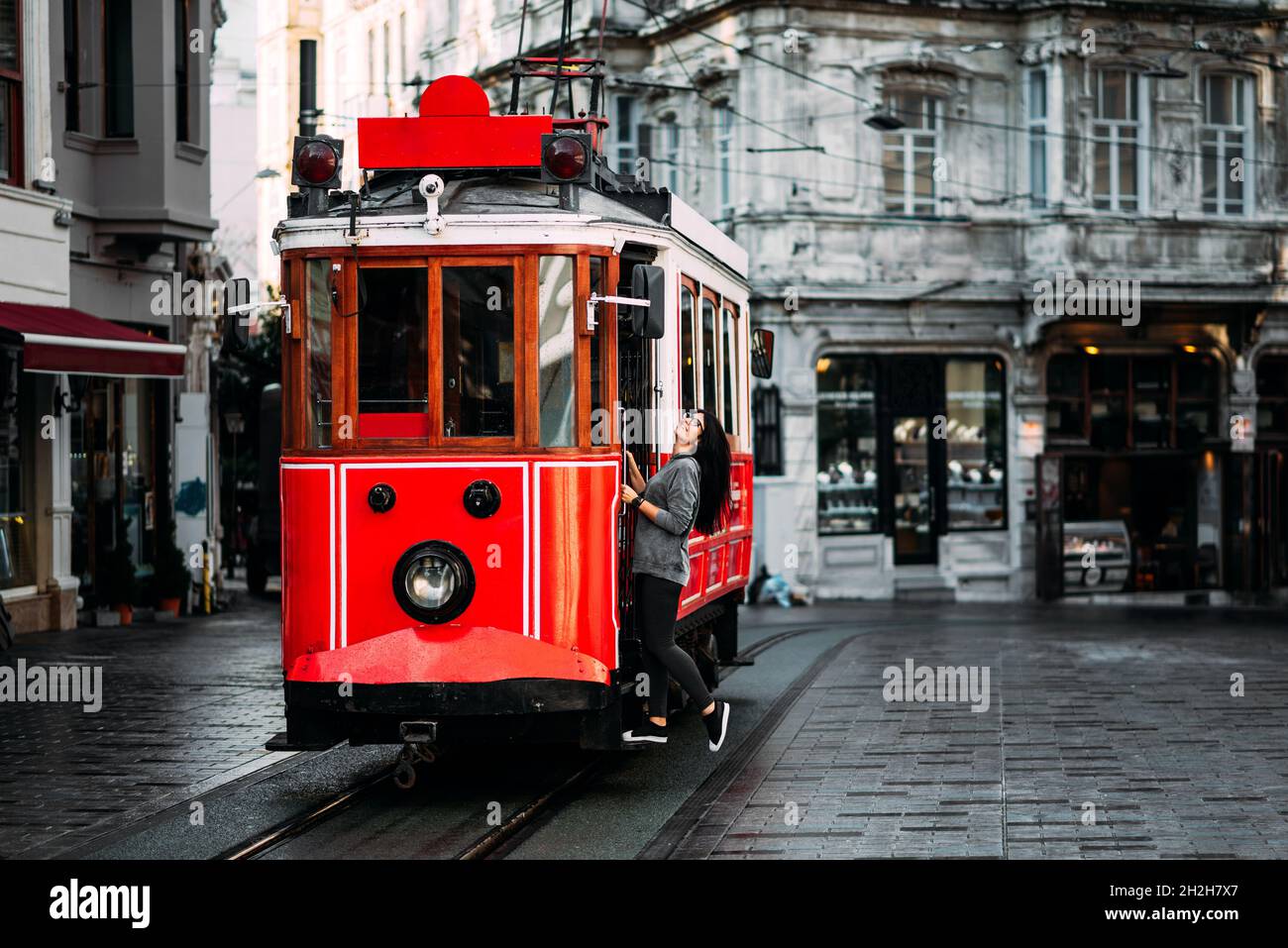 Girl in a vintage tram on the Taksim Istiklal street in Istanbul. Girl on  public transport. Old Turkish tram on Istiklal street, Turkey Stock Photo -  Alamy