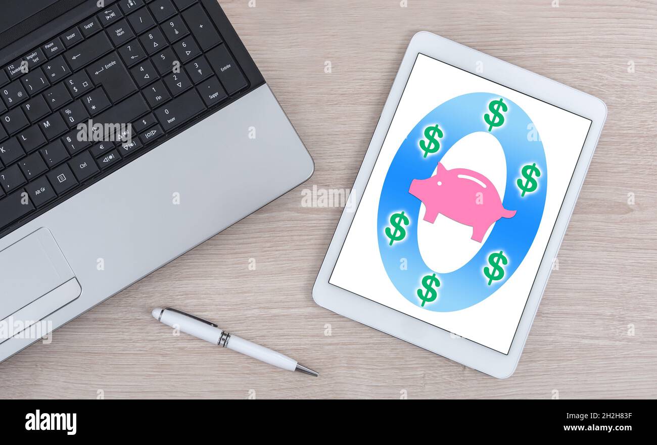 Saving money concept shown on a digital tablet Stock Photo