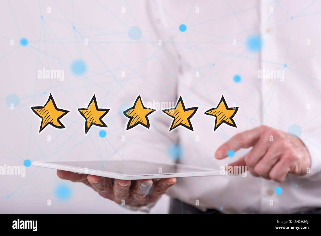 Quality concept above a tablet held by a man in background Stock Photo