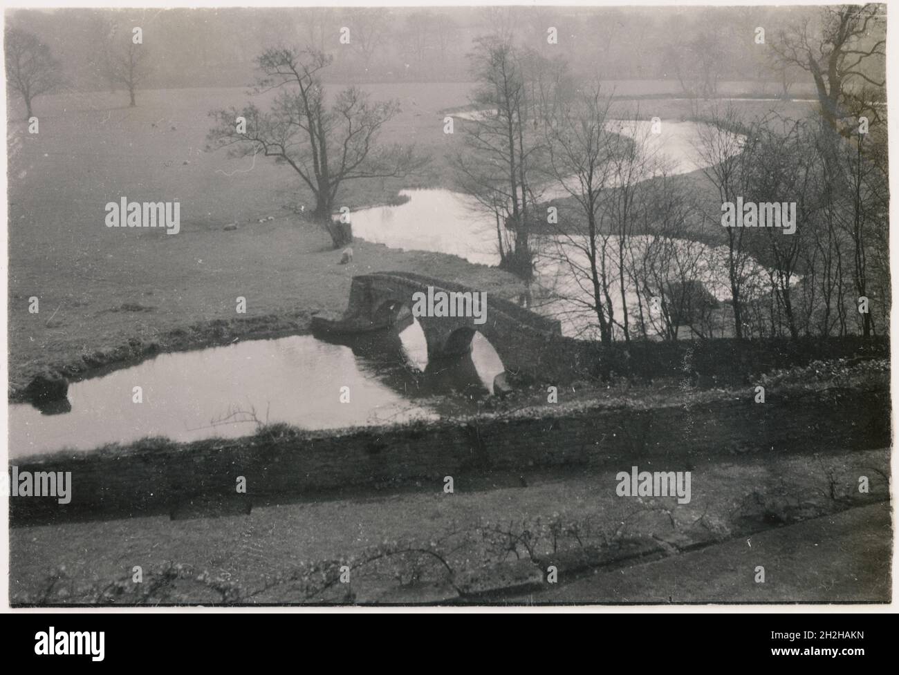 Dorothy Vernon's Bridge, Haddon Hall, Nether Haddon, Derbyshire Dales, Derbyshire, 1950-1964. A view from Haddon Hall, looking down towards Dorothy Vernon's bridge over the River Wye. The bridge derives its name from the legend that Dorothy Vernon (1544-1584), the heiress of Haddon Hall, escaped over this bridge to elope with her lover during the festivities of her sister's wedding. Stock Photo