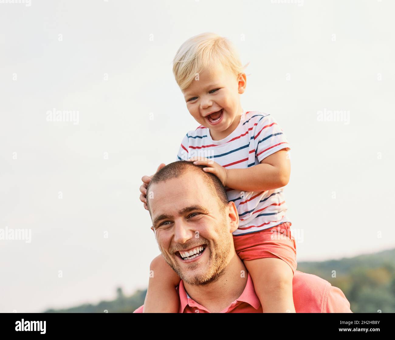 child family outdoor man father boy son happy happiness lifestyle having fun bonding together smiling Stock Photo
