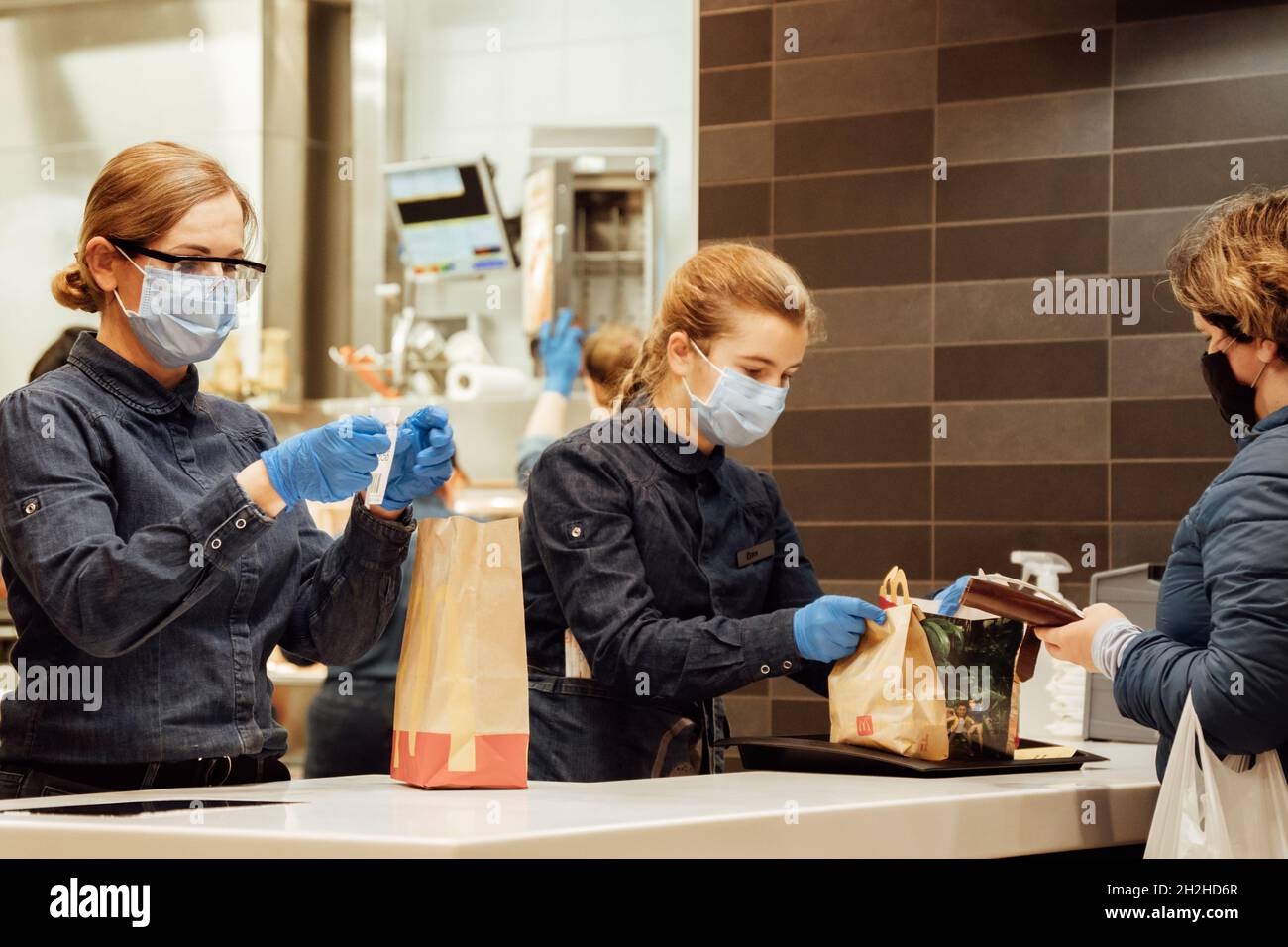 McDonald's staff gives customers their takeaway orders Stock Photo - Alamy