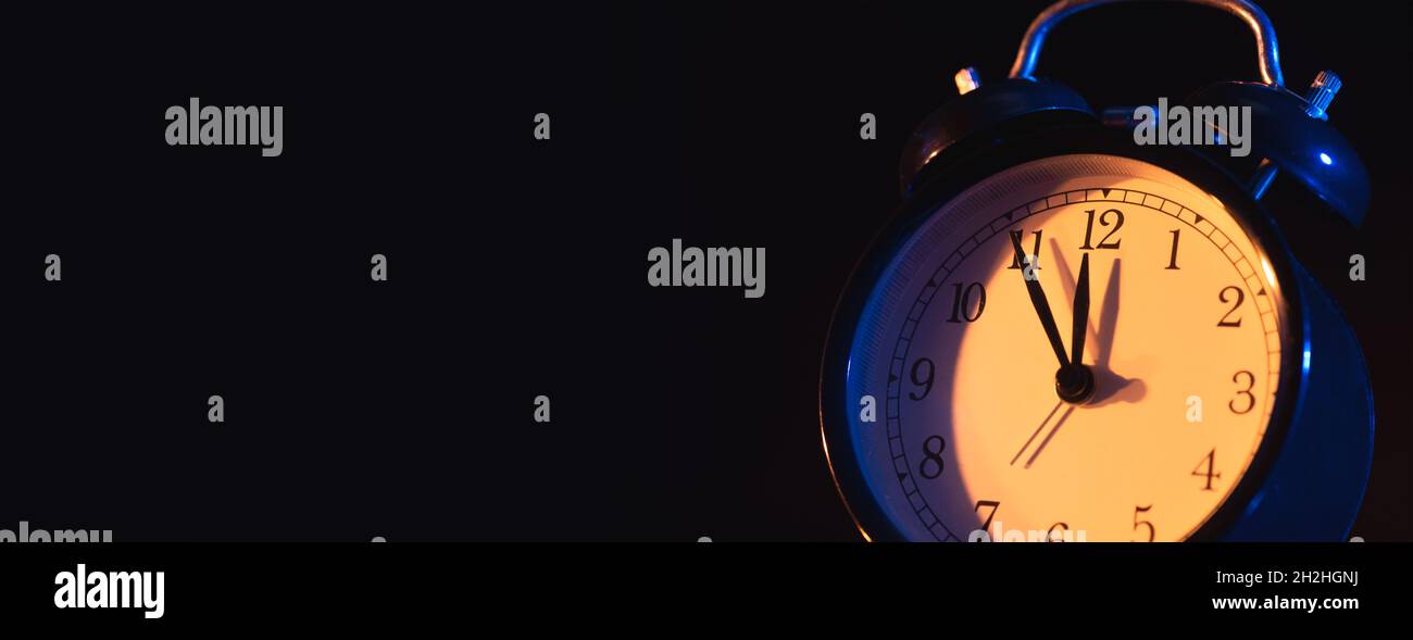 Five minutes to midnight. Changing the clocks, time adjustment