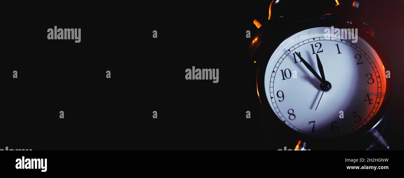 Five minutes to midnight. Changing the clocks, time adjustment