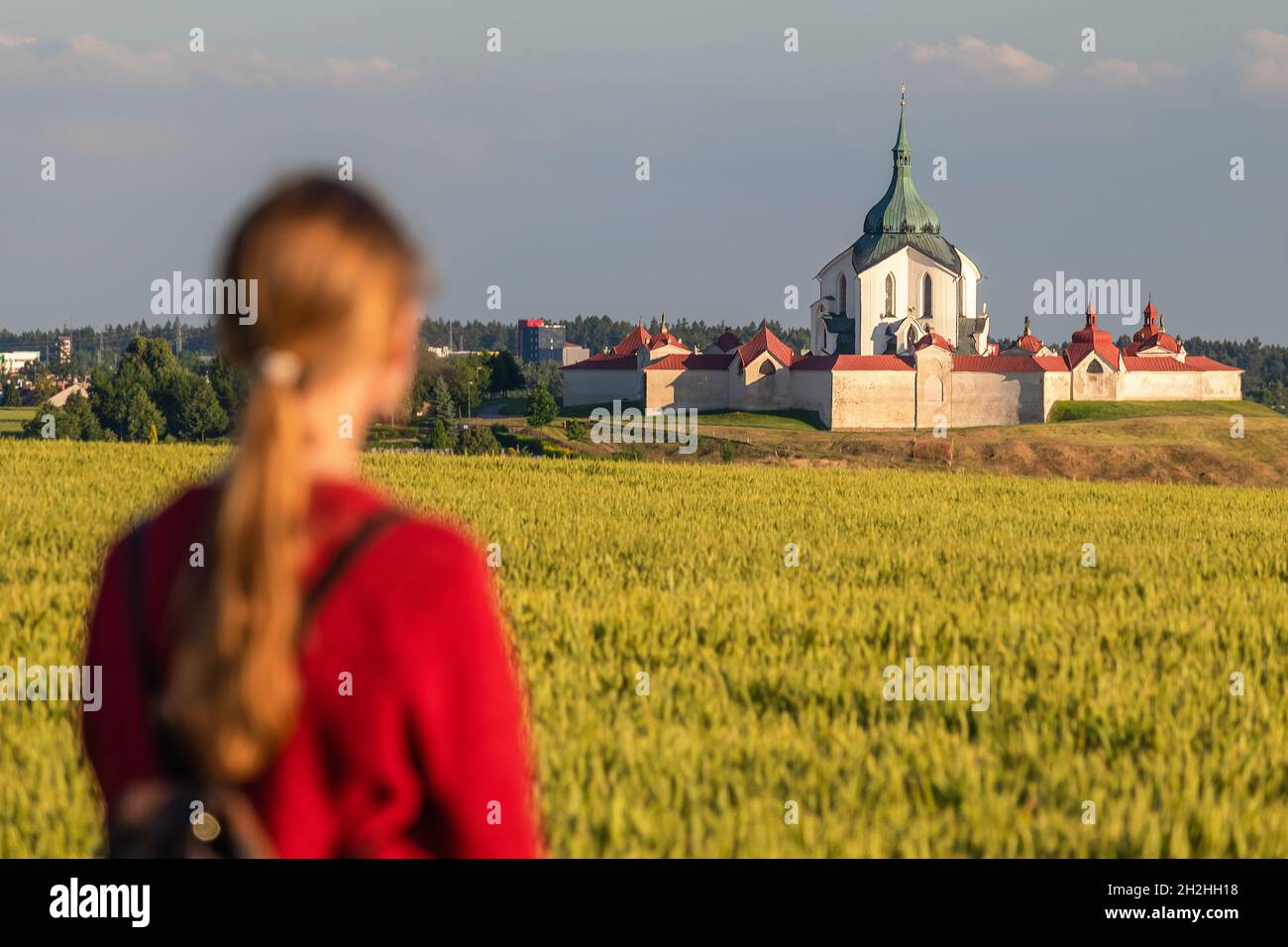 woman looking at the Pilgrimage Church of Saint John of Nepomuk at Zelena Hora, Zdar nad Sazavou, Czech republic Stock Photo