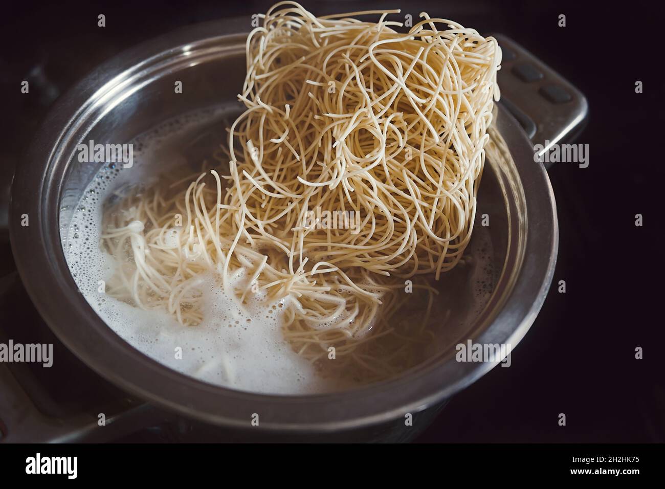 Ramen noodles boiling in a metal pot Stock Photo Alamy