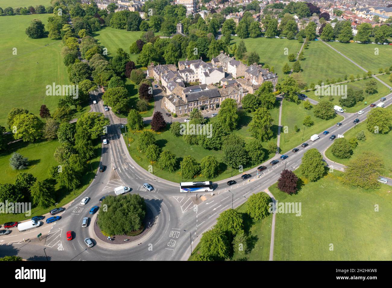 Aerial photo of the beautiful historical town of Harrogate in the UK showing the residential housing estate on the large roundabout with fields at eit Stock Photo