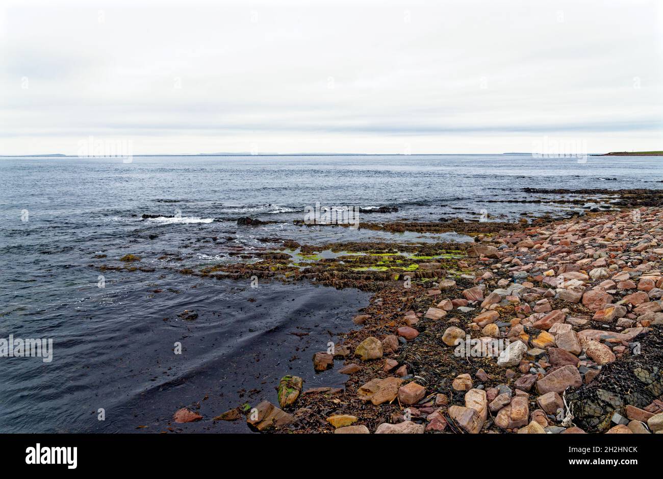 Rocky coastal landscape near John o 'Groats, County of Caithness, Scotland, United Kingdom, Europe - 18th of July 2021 Stock Photo
