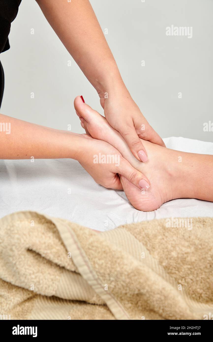 Professional masseuse massaging her female client Stock Photo Alamy