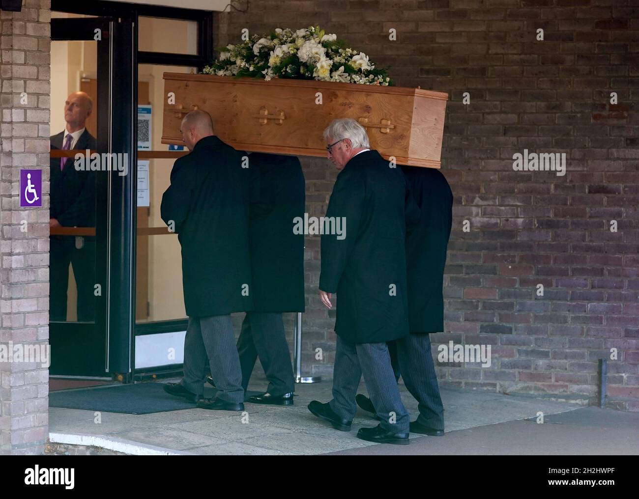 The casket is carried inside before the funeral at Chelmsford Crematorium. Former striker Jimmy Greaves died aged 81 on September 19th. He holds the record of 266 goals for Tottenham Hotspur, 357 goals in English top-flight football, and scored a record six hat-tricks for England. Picture date: Friday October 22, 2021. Stock Photo