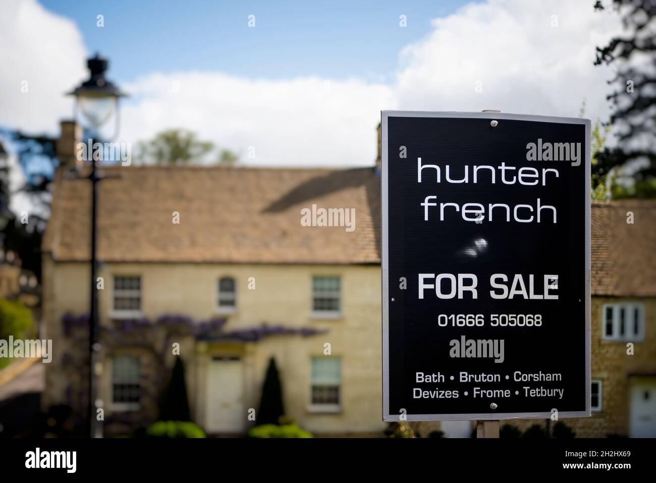 For Sale sign by estate agent, Tetbury, Gloucestershire, UK Stock Photo
