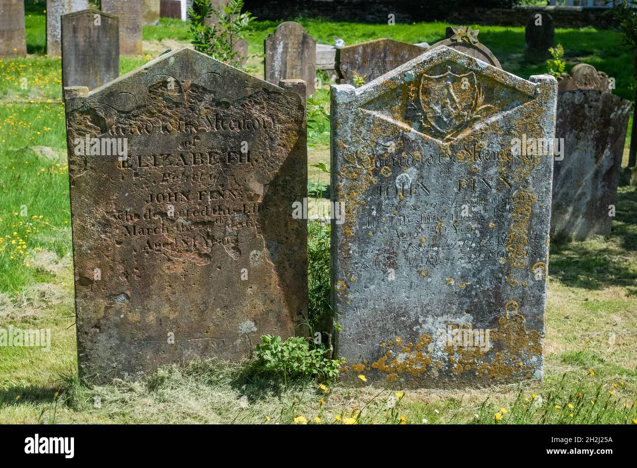 Two Headstones in the sunshine, Lydd Burial ground Kent Stock Photo