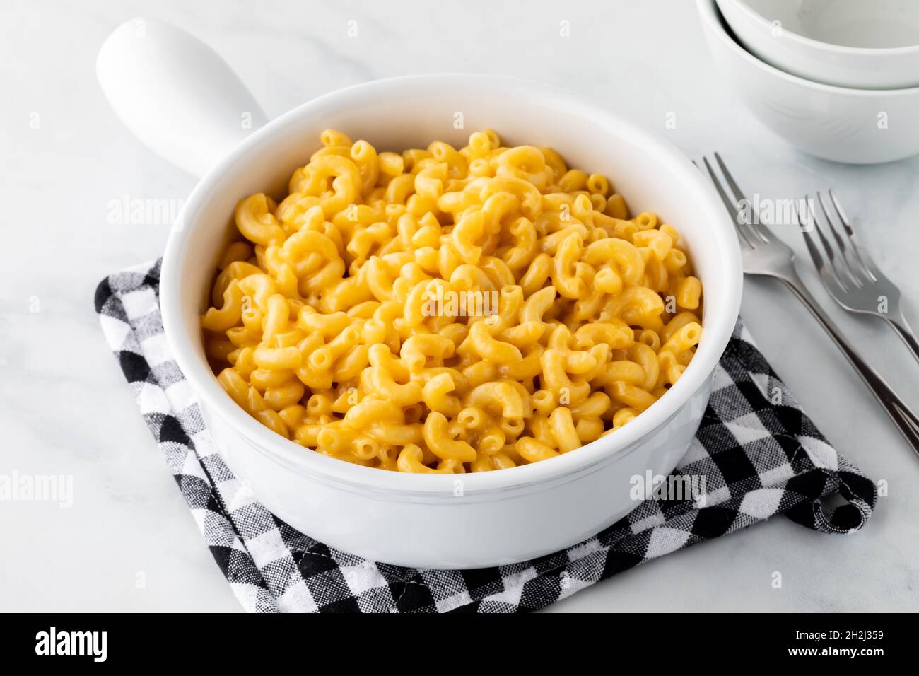 A large casserole bowl filled with homemade macaroni and cheese Stock