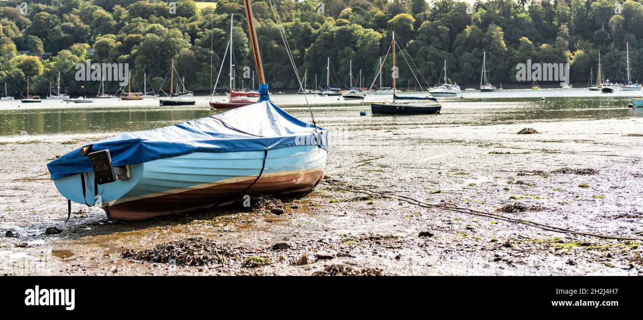 Beached sailing boat at low tide on the River Dart near Dittisham, South Devon, United Kingdom Stock Photo