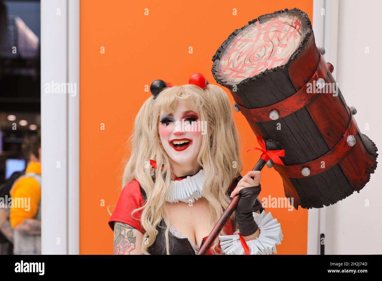ExCel, London, UK. 22nd Oct, 2021. A cosplayer has fun posing as Harley Quinn, a character by DC Comics. Cosplayers, fans and visitors once again descend on the ExCel London exhibition centre for MCM Comic Con. MCM London Comic Con returns 22-24 October for a celebration of Pop Culture. Credit: Imageplotter/Alamy Live News Stock Photo