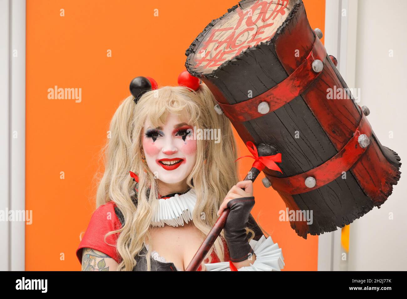 ExCel, London, UK. 22nd Oct, 2021. A cosplayer has fun posing as Harley Quinn, a character by DC Comics. Cosplayers, fans and visitors once again descend on the ExCel London exhibition centre for MCM Comic Con. MCM London Comic Con returns 22-24 October for a celebration of Pop Culture. Credit: Imageplotter/Alamy Live News Stock Photo