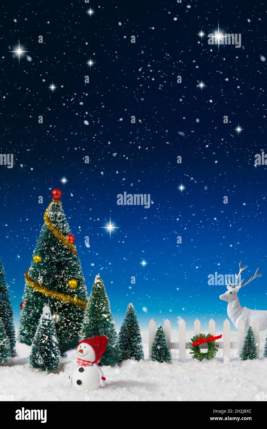 Model Christmas village trees in a fake snow background Stock Photo Alamy
