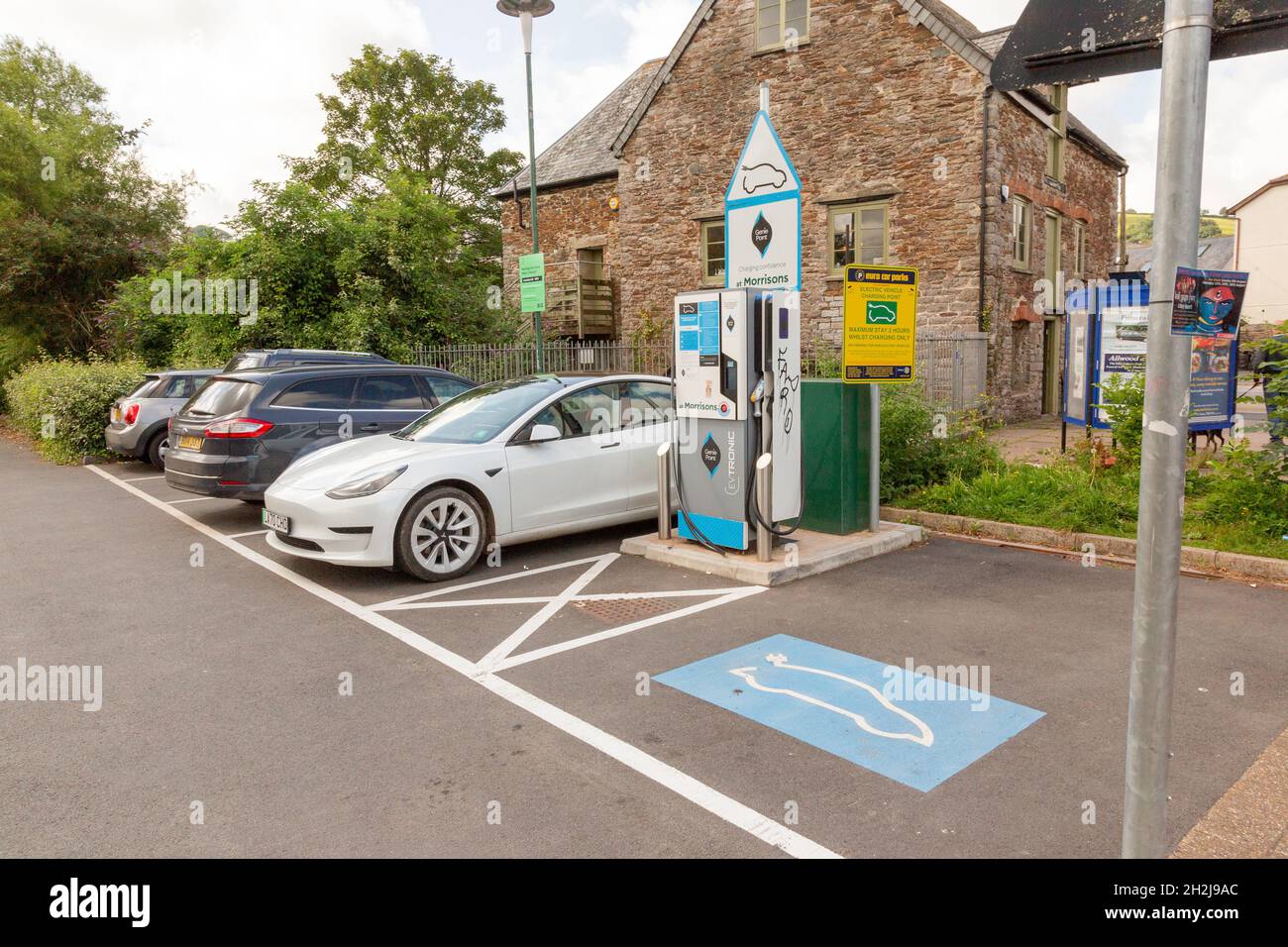 Electric car charge point EV Morrisons supermarket, Totnes, Devon, England, United Kingdom. Stock Photo