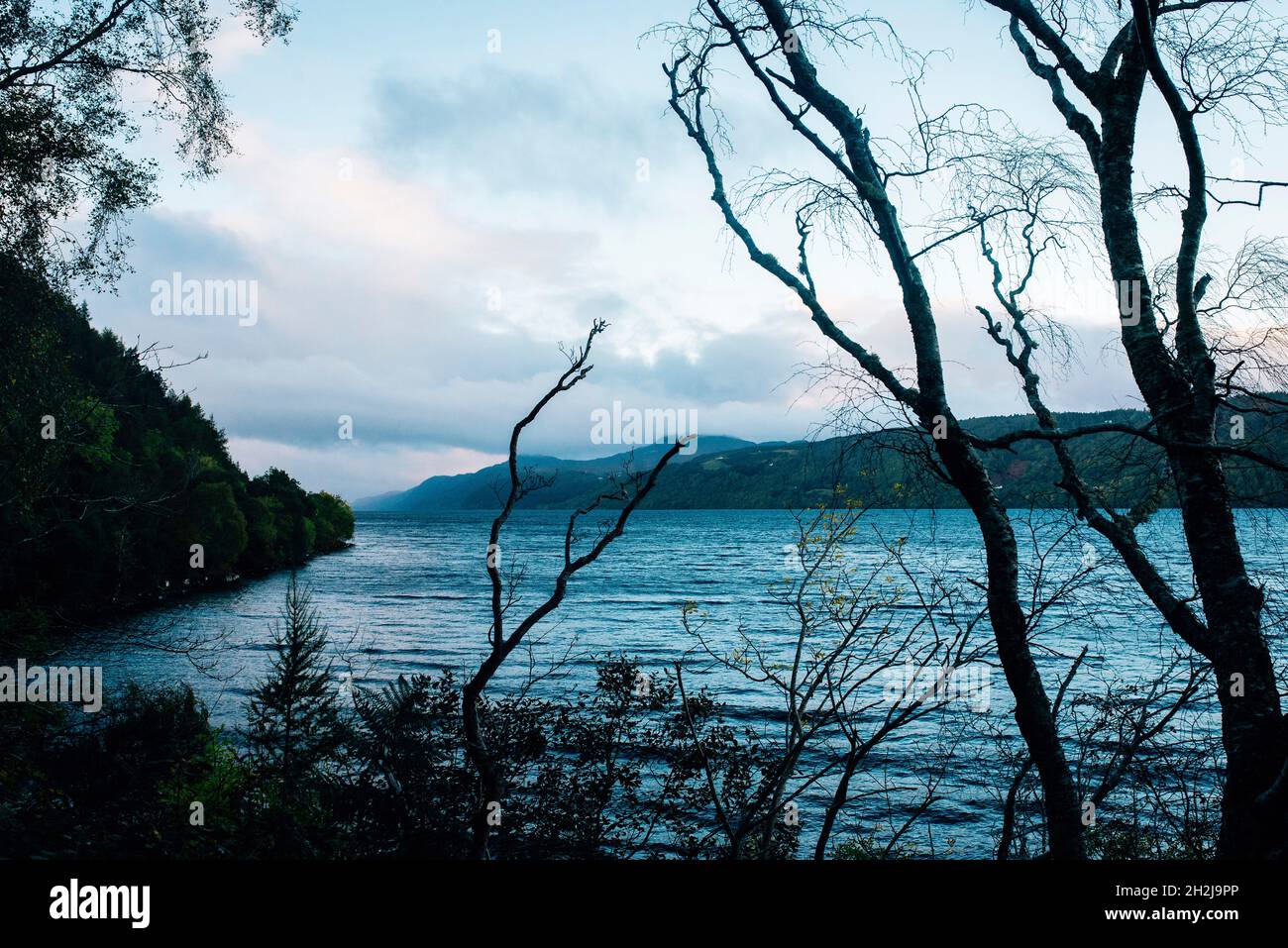 Loch ness, inverness, scotland at sunrise on a misty morning Stock Photo