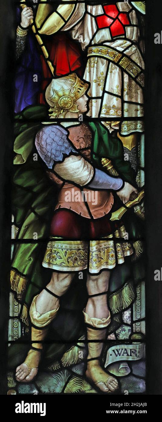 A stained glass window by Percy Bacon depicting War, St Peter's Church, Dunchurch, Warwickshire Stock Photo