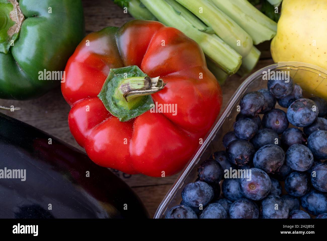 Fresh mixed bio vegetable and fruits in wooden basket harvested in the morning. Bio box from regional local farmers market concept Stock Photo