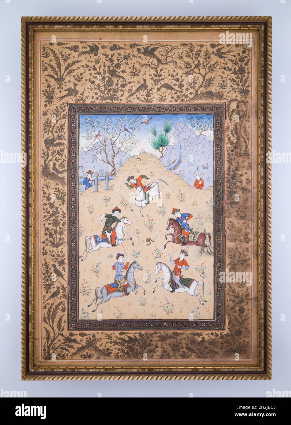 Antique Persian Miniature Painting of Chovgan Polo Game. Folio from ‘Guy O Chaugan’ by Arifi. 19th century Stock Photo