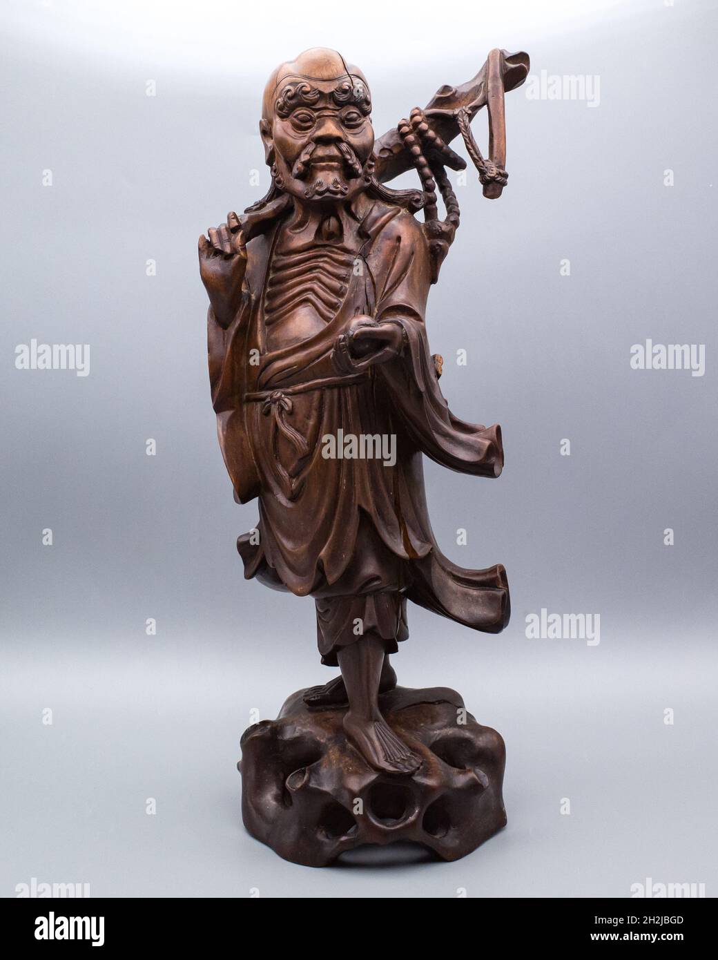 Large Antique Chinese Carved Hardwood Figure of a Standing Immortal or Luohan Stock Photo