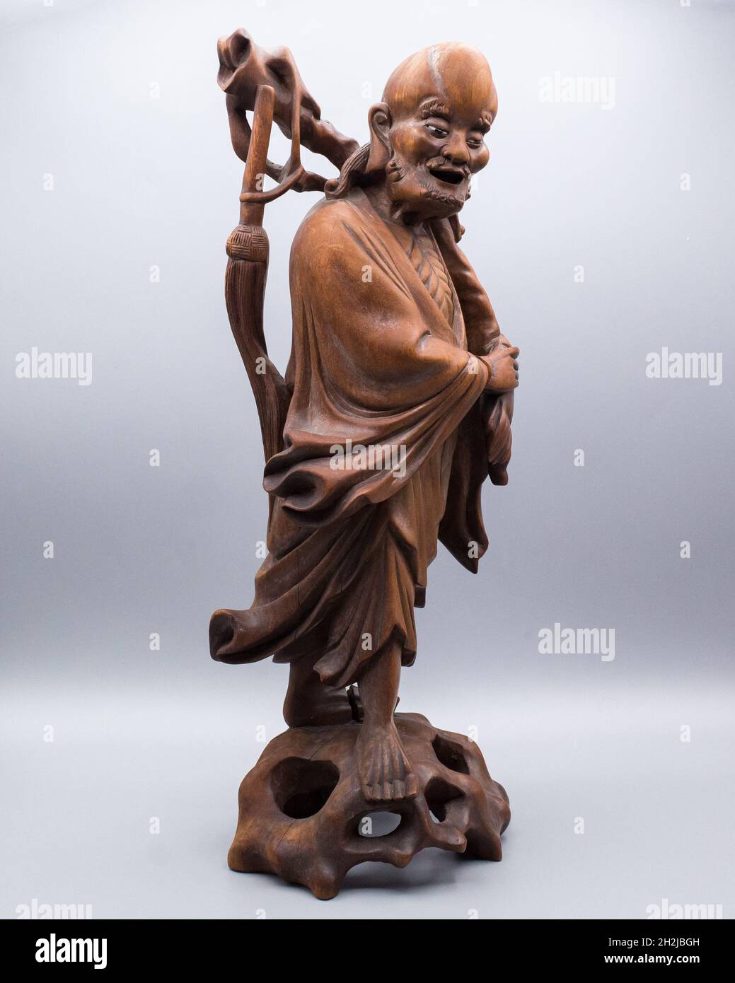 Large Antique Chinese Carved Hardwood Figure of a Standing Immortal or Luohan Stock Photo