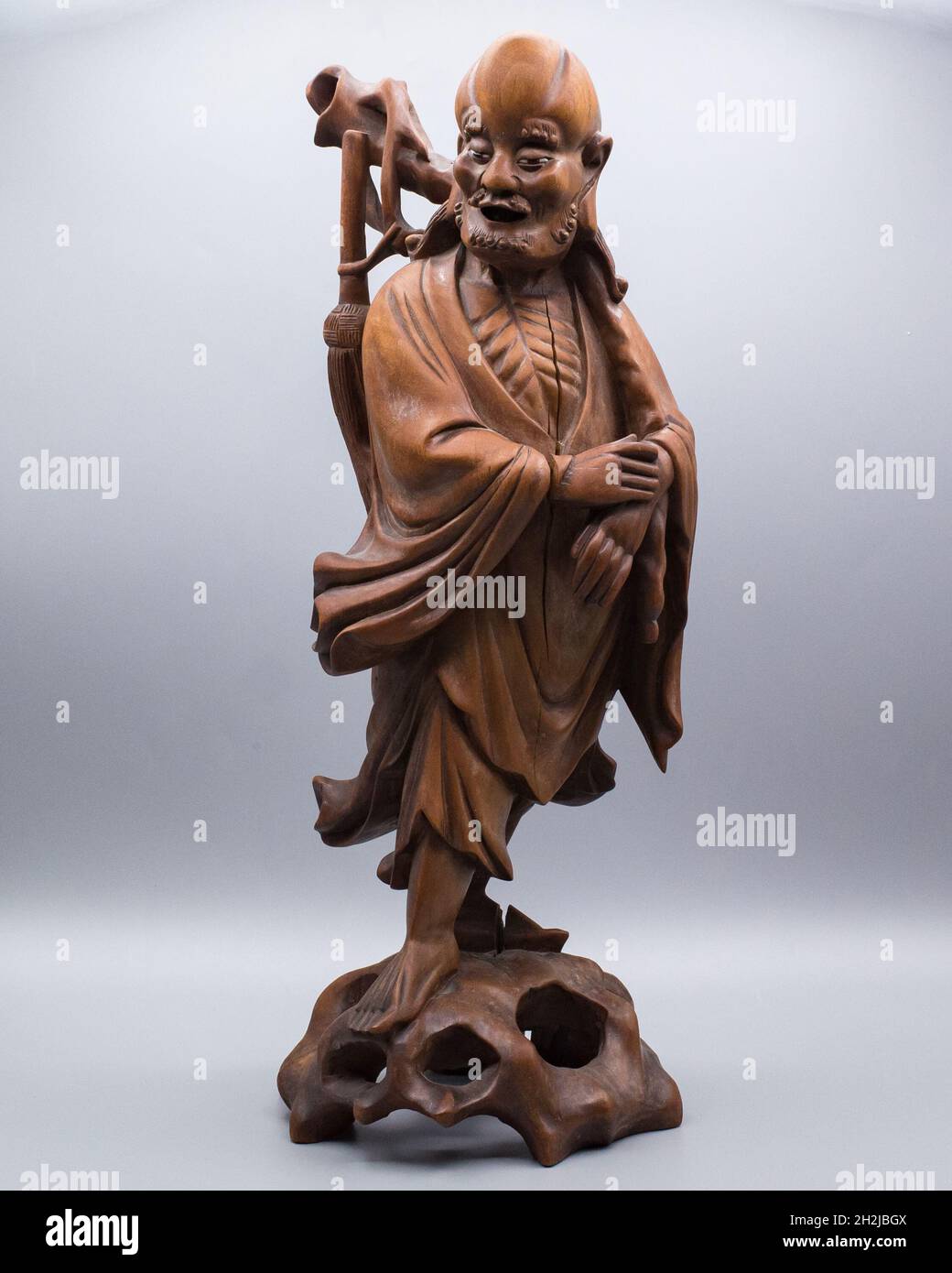 Large Antique Chinese Carved Hardwood Figure of a Standing Immortal or Luohan Stock Photo