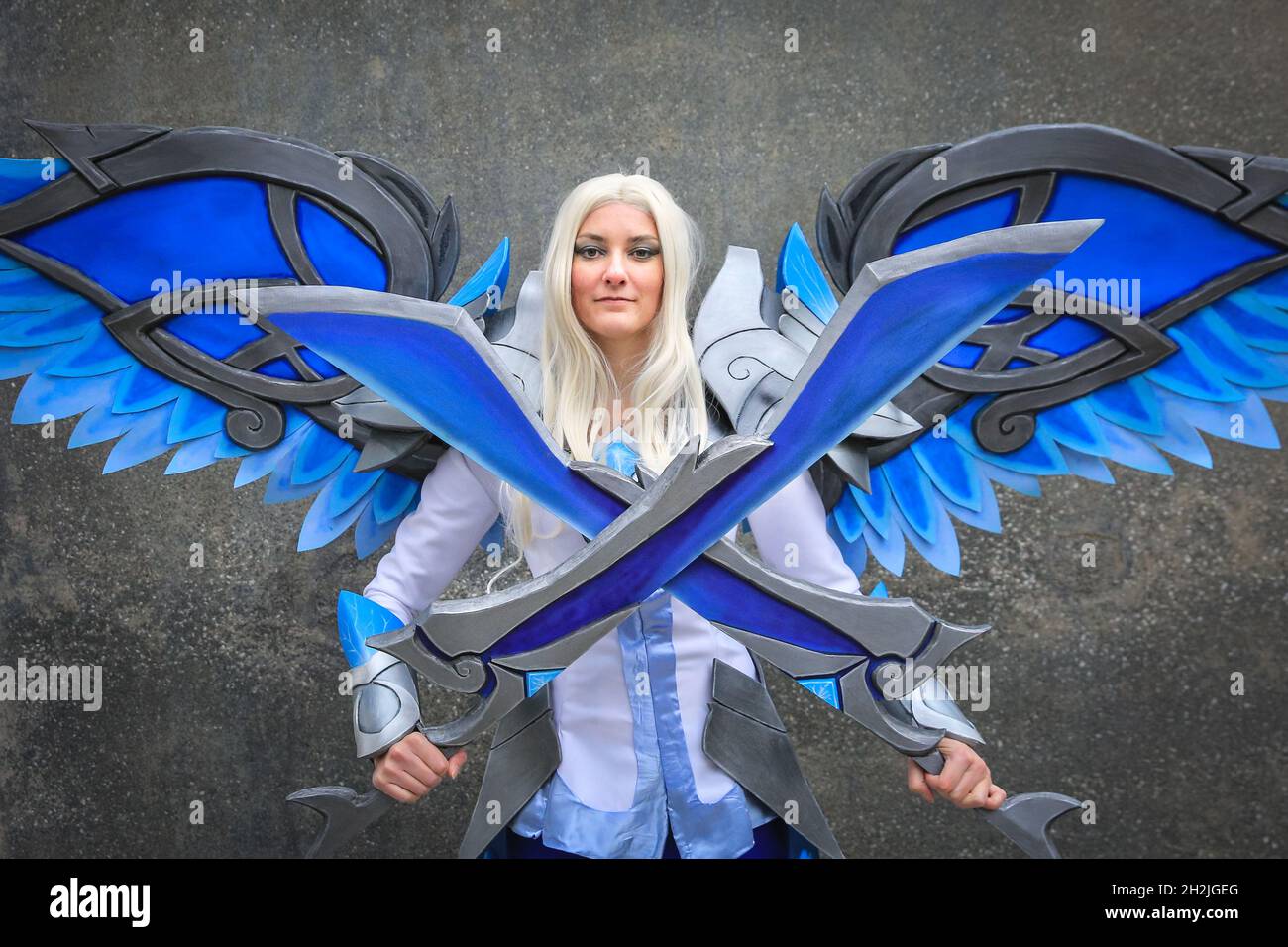 ExCel, London, UK. 22nd Oct, 2021. A cosplayer as Kayle from League of Legends. Cosplayers, fans and visitors once again descend on the ExCel London exhibition centre for MCM Comic Con. MCM London Comic Con returns 22-24 October for a celebration of Pop Culture. Credit: Imageplotter/Alamy Live News Stock Photo