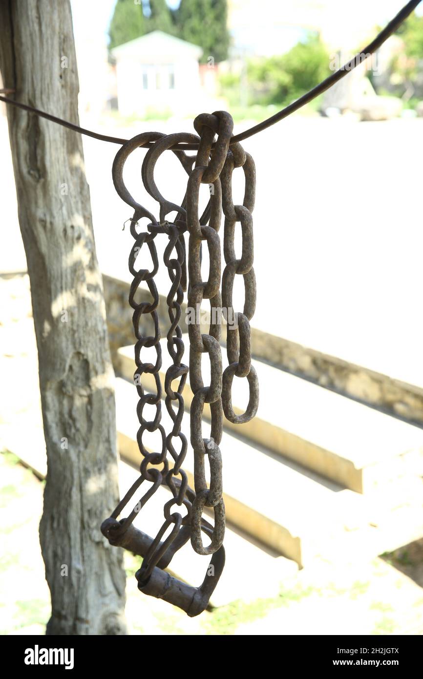 Ancient thick chains. Iron horse saddle . stirrup with which the rider