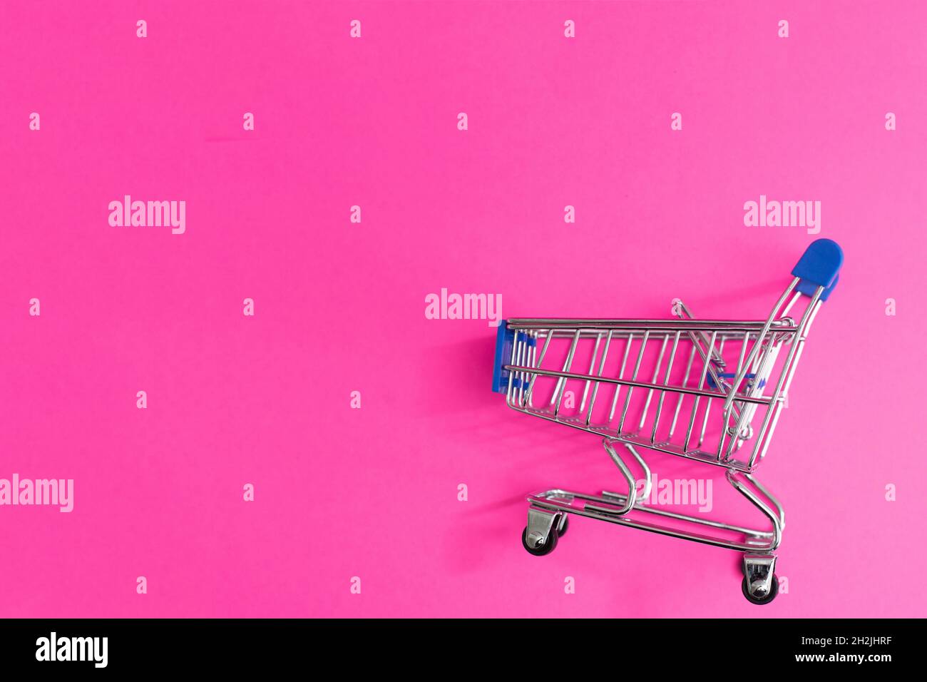 A Shopping Cart Isolated On pink background Stock Photo - Alamy