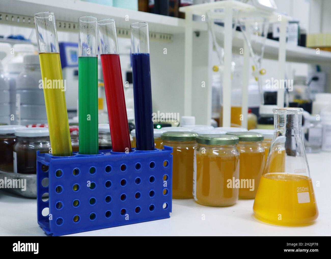 Research Laboratory with 1 bootle in a front of the image. This image represents all the efforts of the science for the better society with researches. Stock Photo