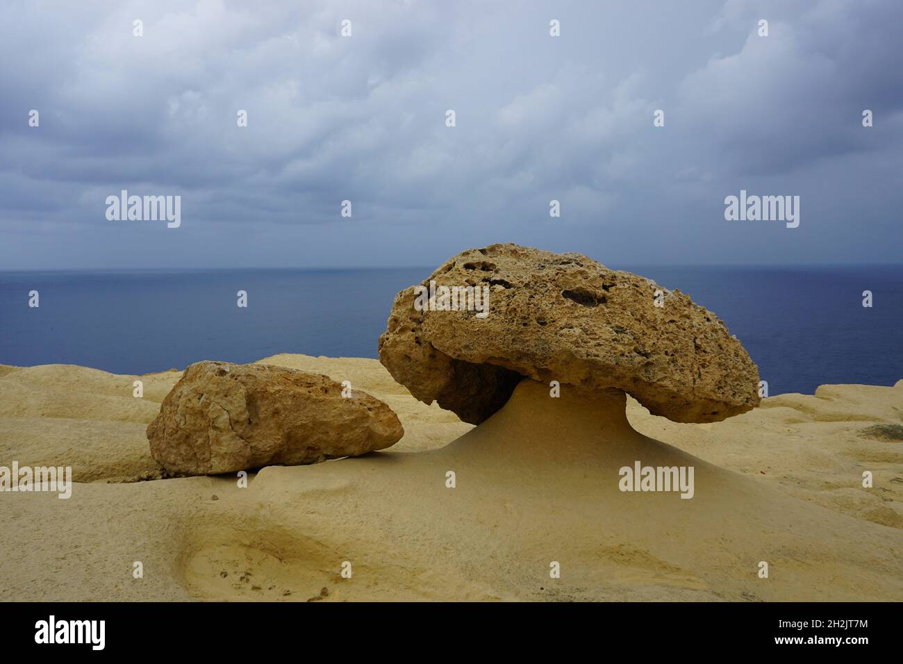 weathered limestone in mushroom shape on beach on Gozo Island, Malta. Photo by Willy Matheisl Stock Photo