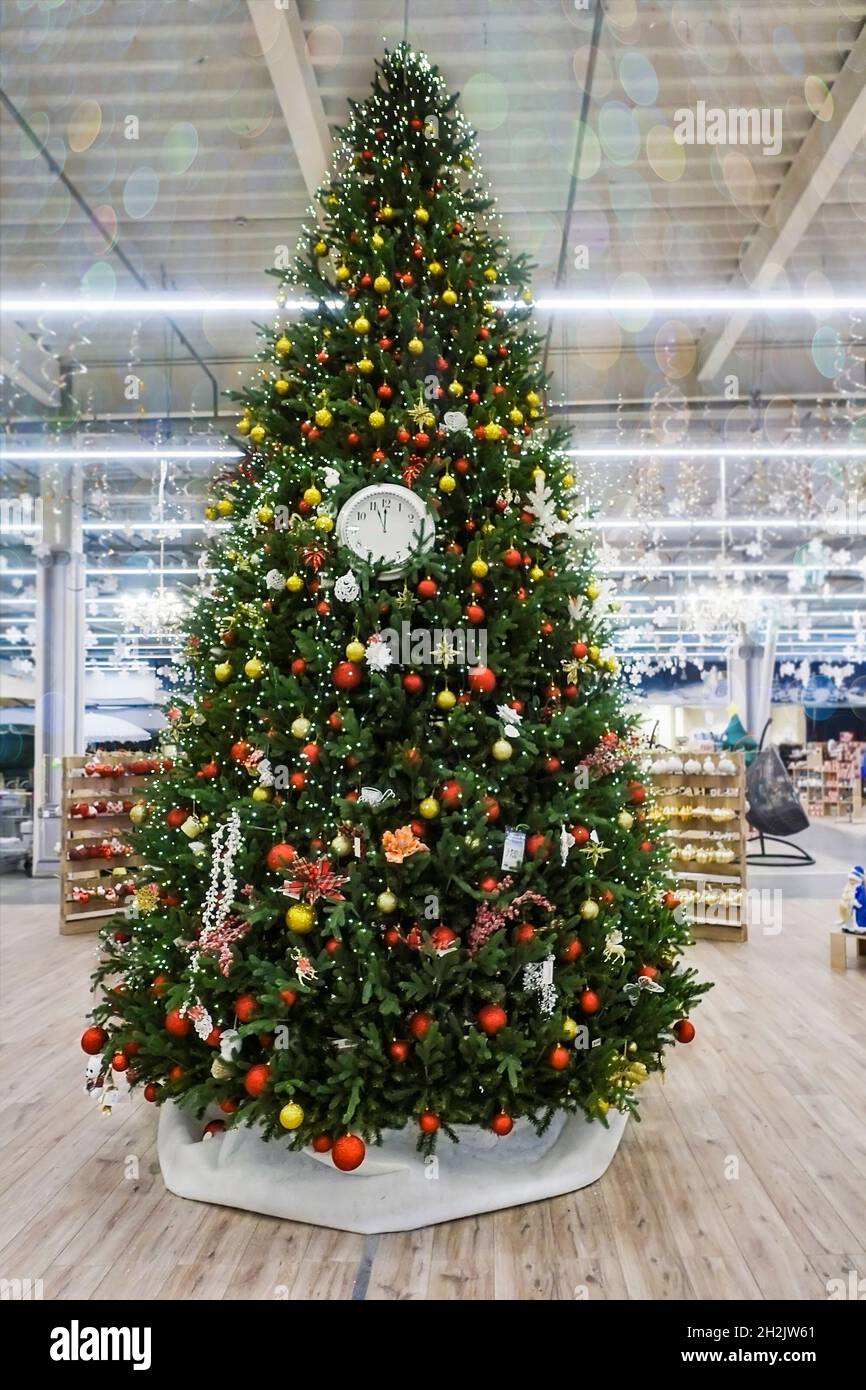 Christmas tree decorated with clocks, colorful toys, garlands and