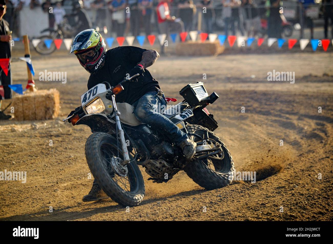 Motocross racer accelerates out of a turn at Glen Helen Raceway Stock Photo