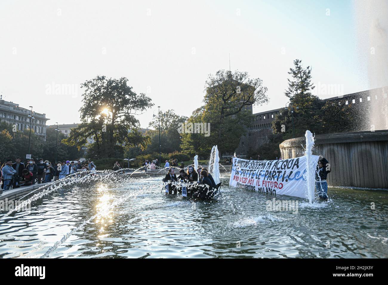 Milan, Italy. 22nd Oct, 2021. Milan, Italy - 22 October 2021: Fridays For Future climate activists wearing masks depicting world leaders, stage a flash mob in front of the Sforza Castle in preparation of the G20 Credit: Piero Cruciatti/Alamy Live News Stock Photo