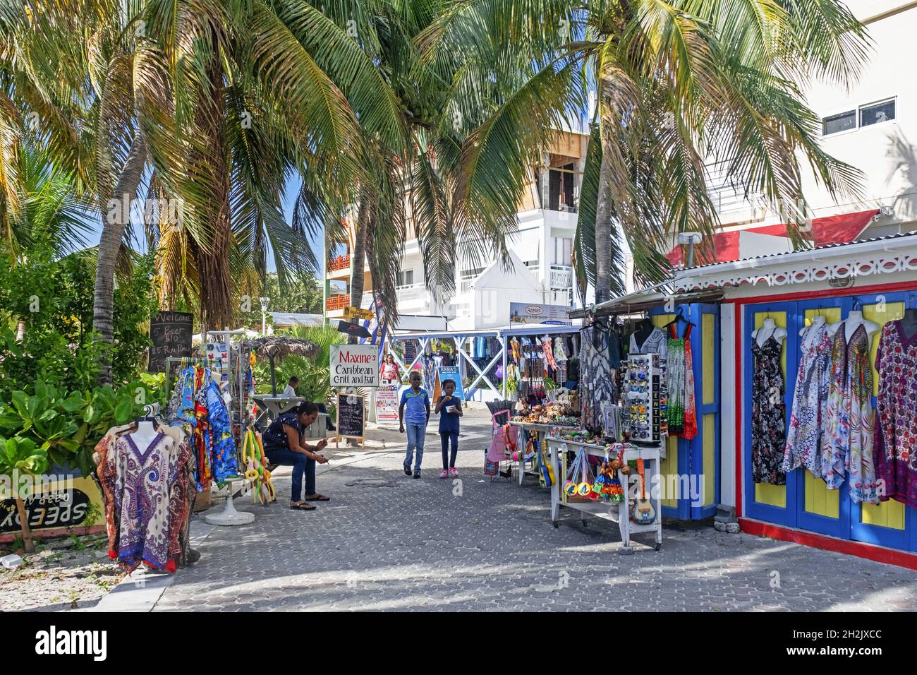 Souvenirs shop and palm trees along boulevard in the capital city Philipsburg of the Dutch island part of Sint Maarten / Saint Martin in the Caribbean Stock Photo
