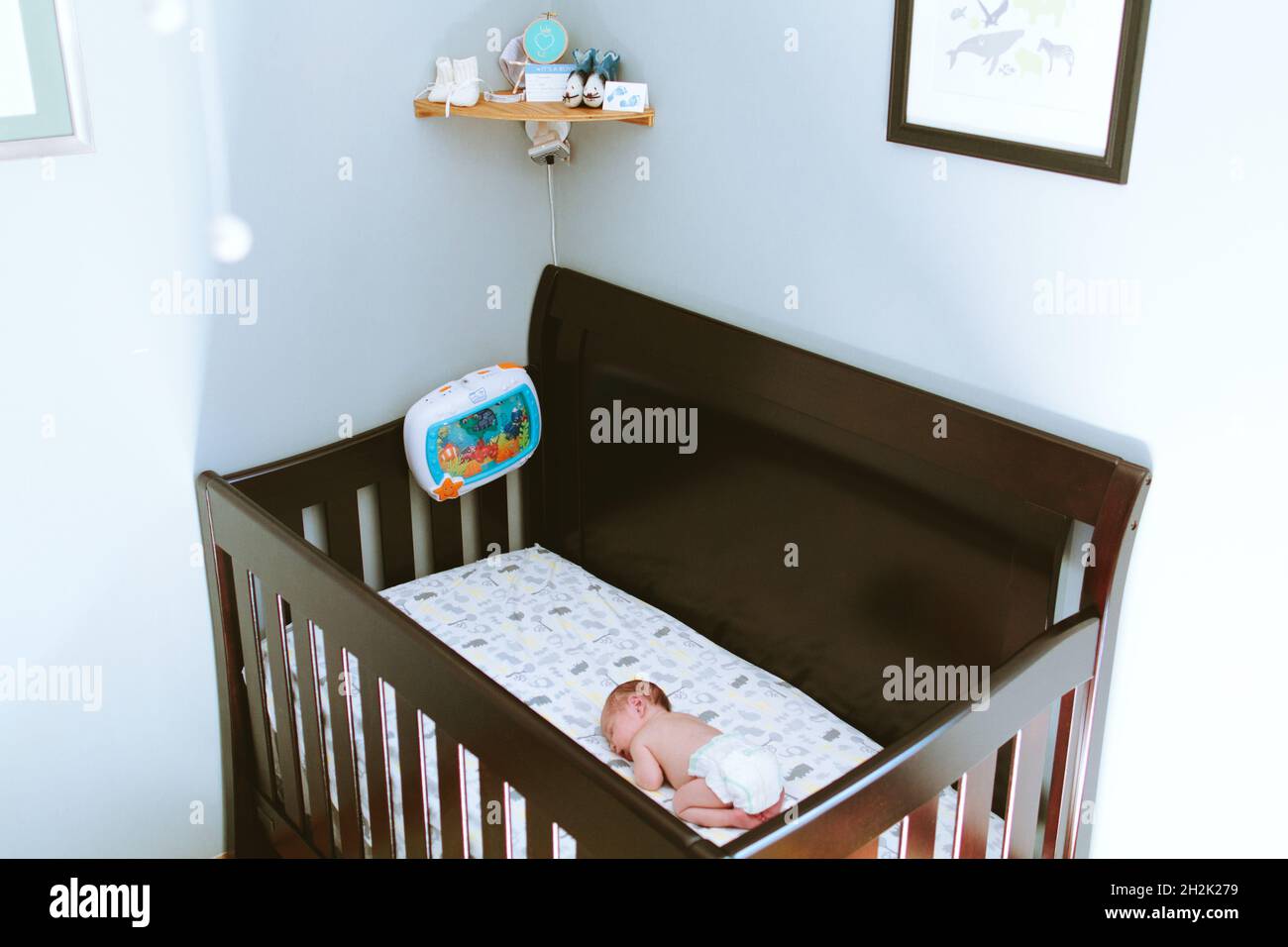 View from above of a baby sleeping in his crib Stock Photo Alamy