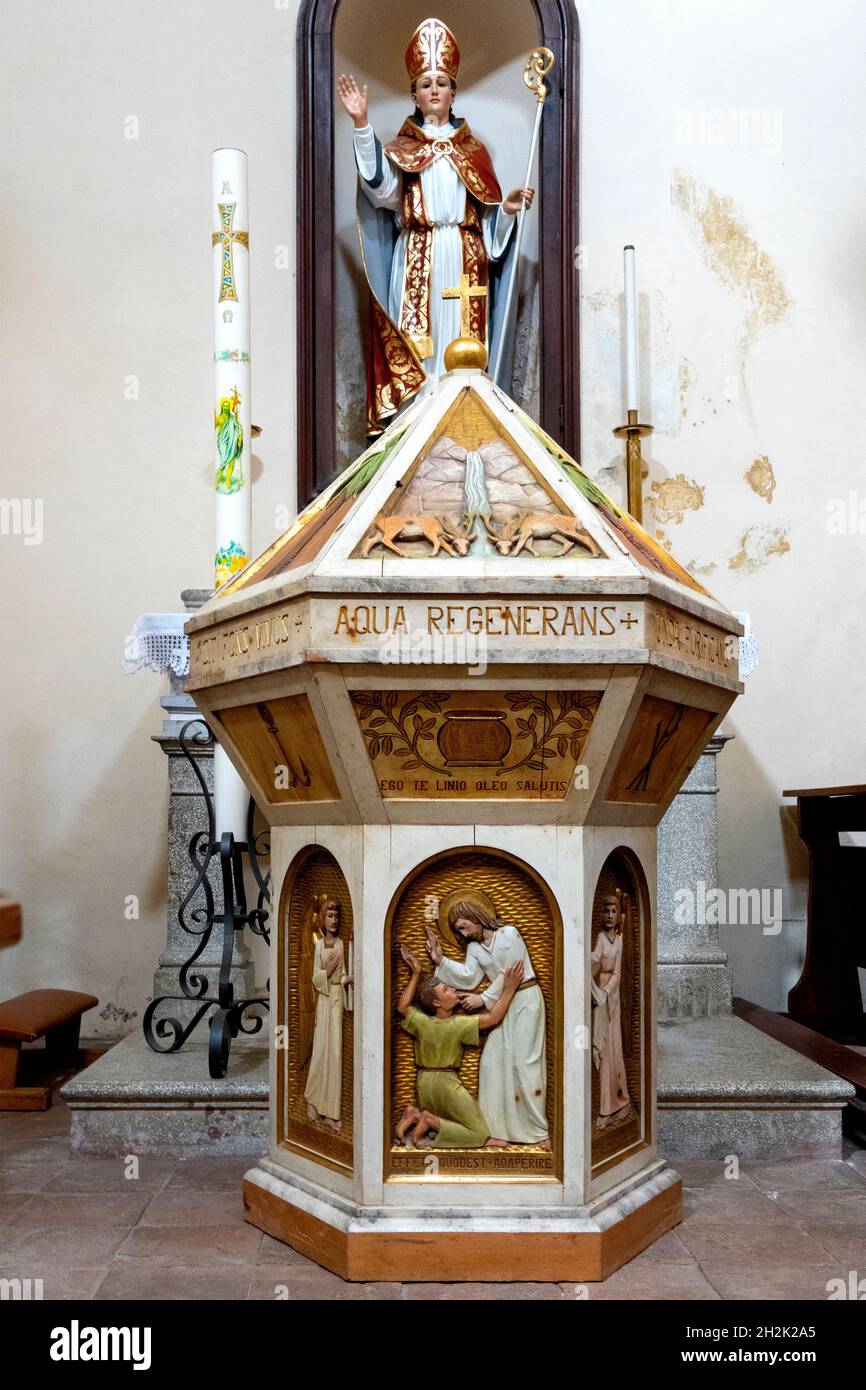 Baptismal font of the Church of Sant'Andrea in Petrella Salto, Italy Stock Photo