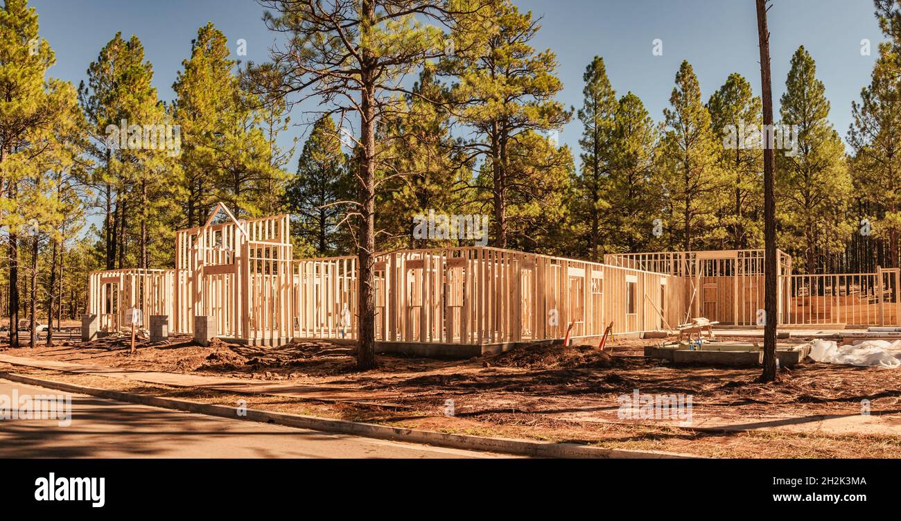 Wood framework of new home being constructed in beautiful area. Stock Photo